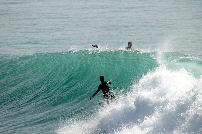 Surfer surf banana point in Tamraght by Original Surf