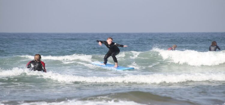 Phot Shows a Solo Surfer Standing on the Board