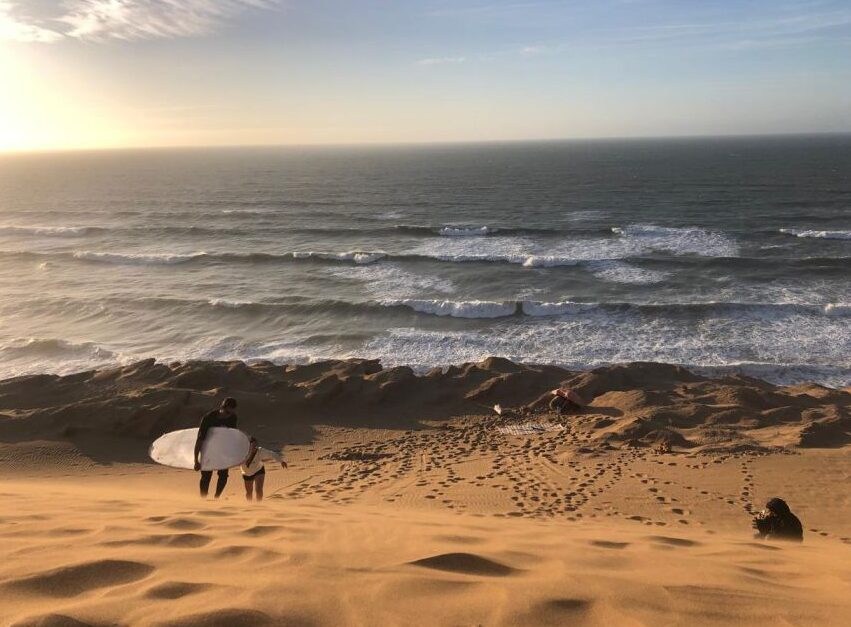 Climbing up the hill for the first sandboarding of the session