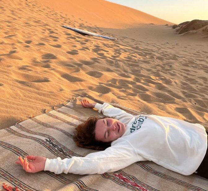 Enjoying a cup of tea after a rewarding sandboarding session