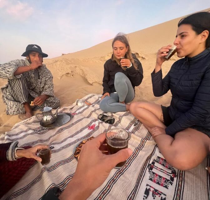 Enjoying a cup of tea after a rewarding sandboarding session