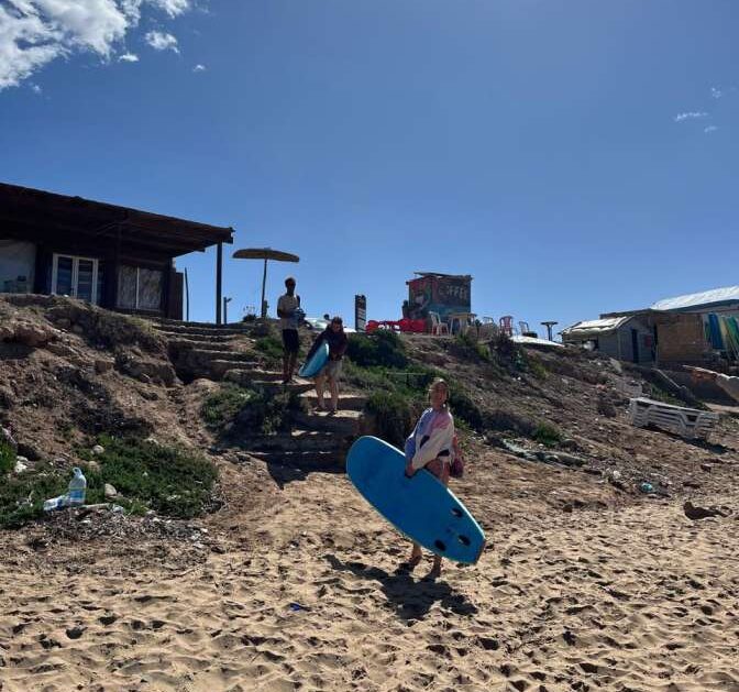 Surfer carrying a board