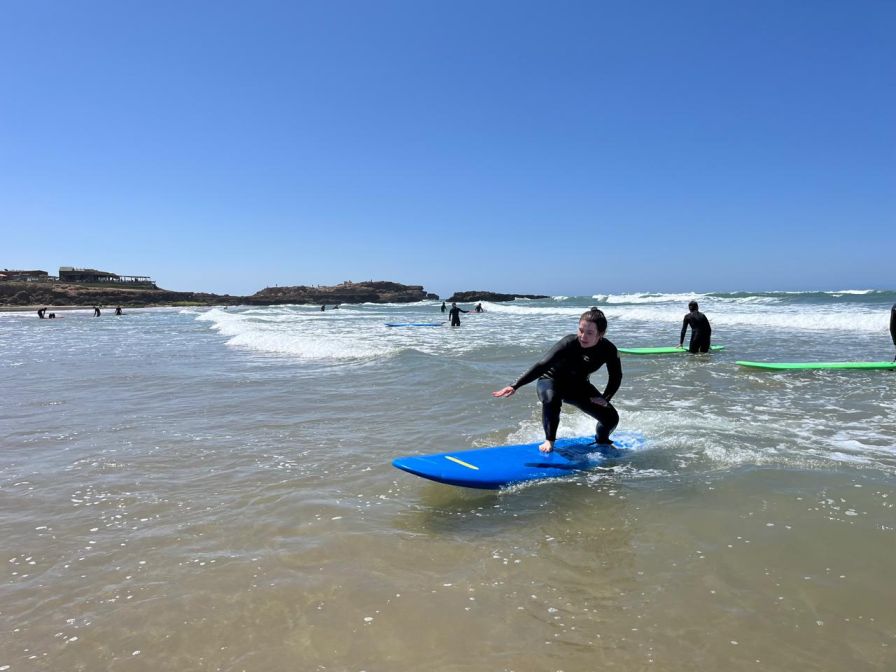 A surfer practicing surf beginner tips