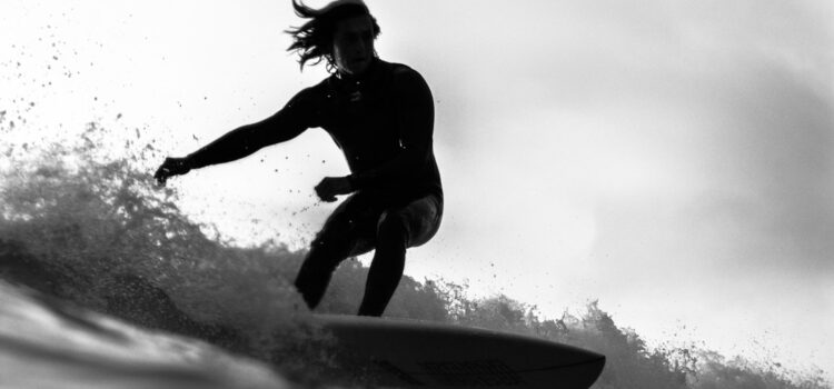 Surfer riding waves