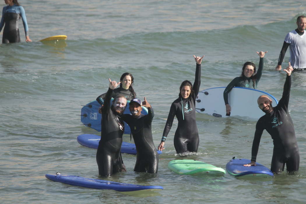 happy students learning to surf in Tamraght
