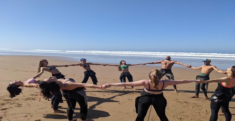 Surfing Experience in Morocco: stretching together, ocean energy, ready to surf